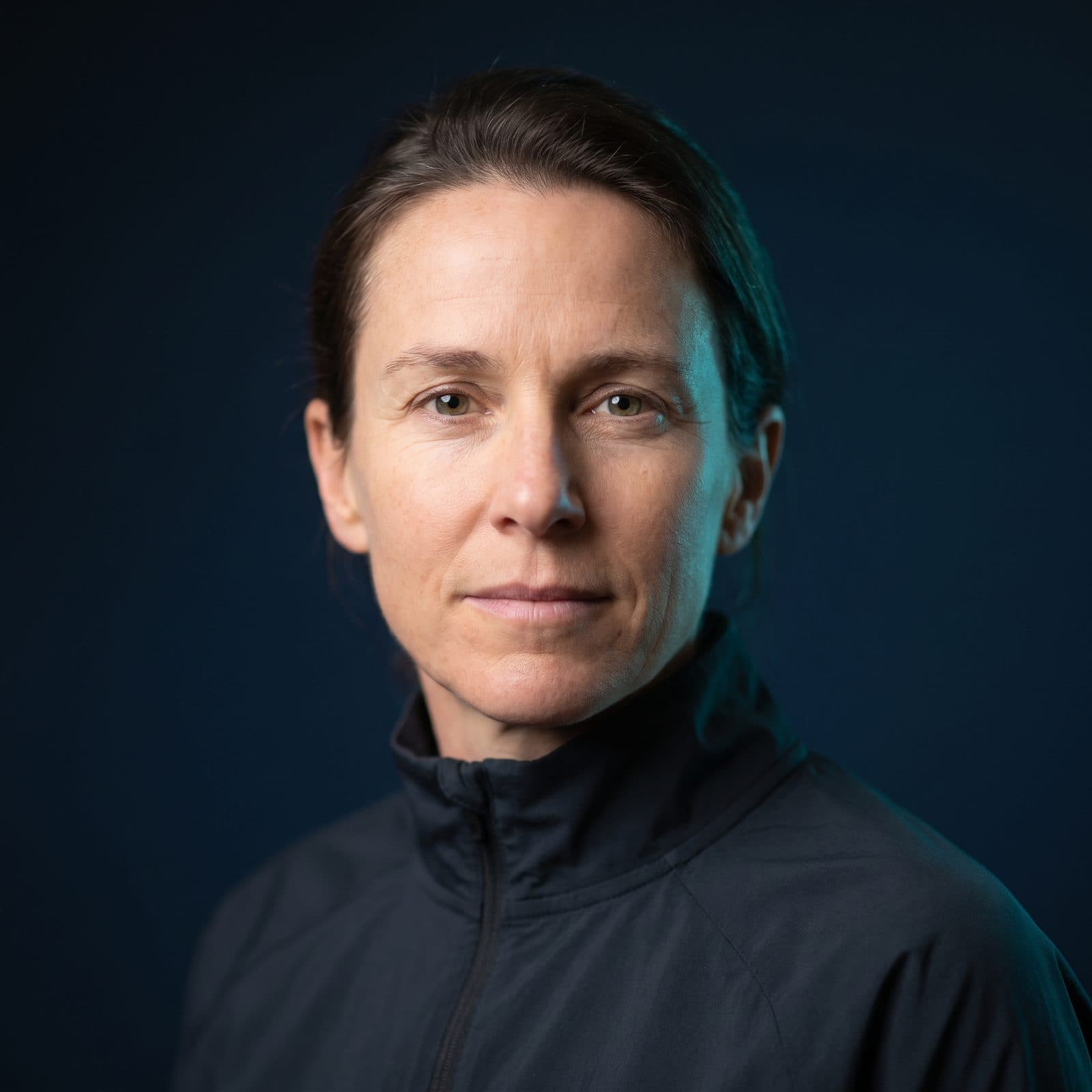 A coach, photographed against a dark ground